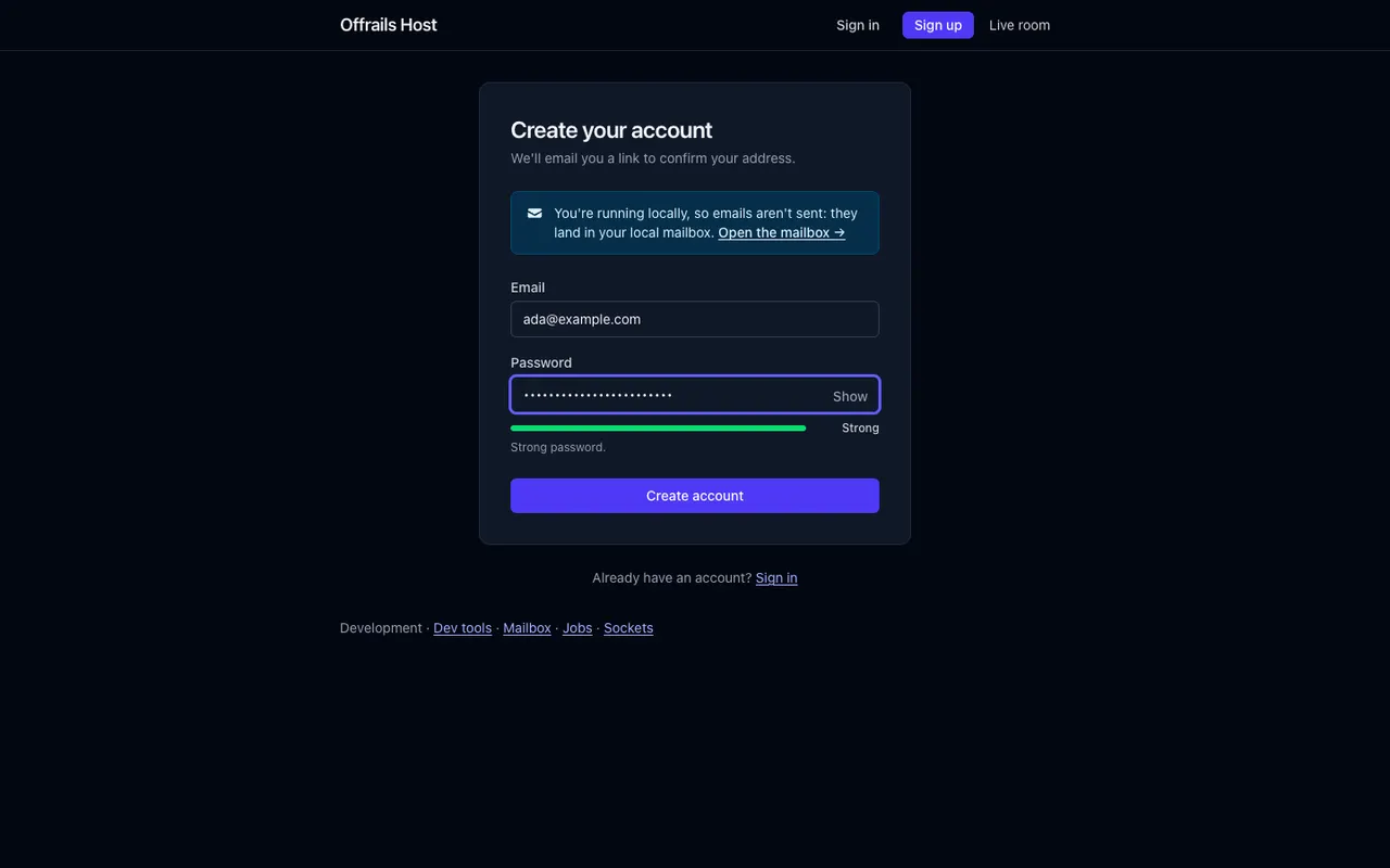 The sign-up form: an email address, a password with a Show button and a strength meter reading Strong, a Create account button, and a note that emails land in the local mailbox in development.